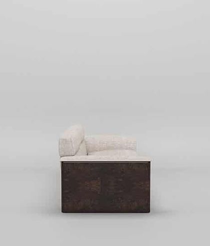 A side view of our modern sofa, showcasing the contrast between the plush, light fabric and the dark, textured wood paneling on the armrest.