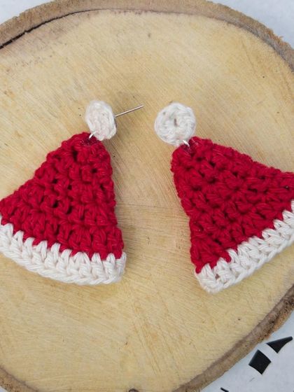 Another angle of the Santa cap earrings, showing the little white pom-pom on top. It's all in the details!