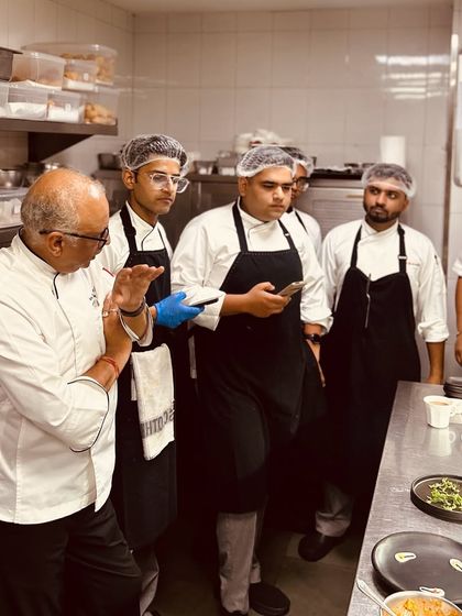 Another moment from a kitchen briefing. This is where we ensure that every dish that leaves the kitchen meets our exacting standards of quality and presentation.