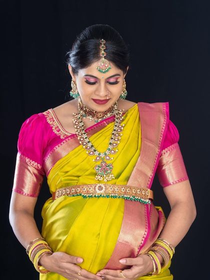 A portrait of the lovely mom-to-be, showcasing her pregnancy glow. The makeup is focused on shimmery eyes and a classic feel to match her traditional attire.