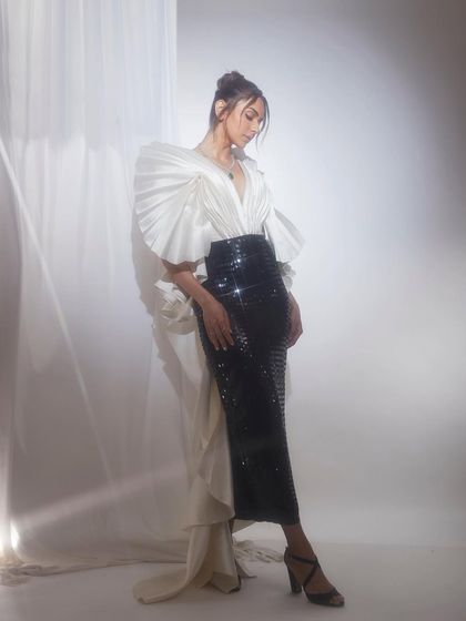 A full look at the Tanieya Khanuja gown for Rakul Preet Singh. The combination of the pleated, sculptural top and a sequined pencil skirt made for a standout ensemble at the Pinkvilla Style Awards.