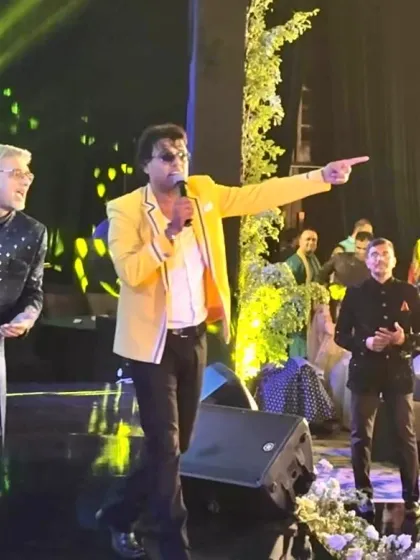 Pointing to a guest to join in the fun. Interactive moments like these are what make my wedding shows feel like a personal concert for the family.