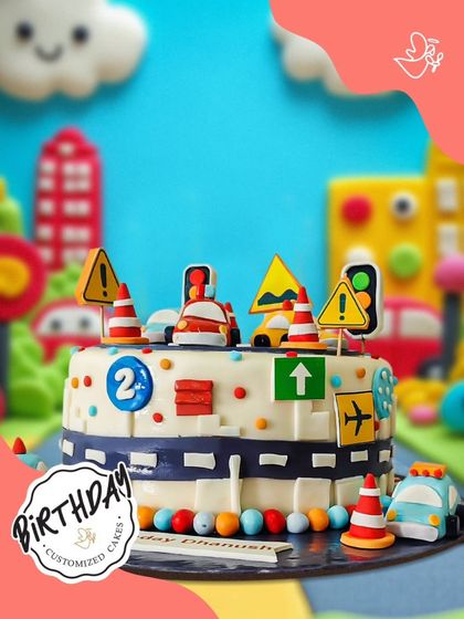 A busy and fun traffic-themed cake for a 2nd birthday. This design is full of cars, traffic signs, and cones, perfect for a little one who loves vehicles.