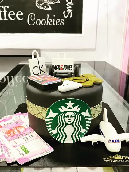 A cake that celebrates all the favorite brands. This design features edible logos and items from Starbucks, Apple, Gucci, Calvin Klein, and more.