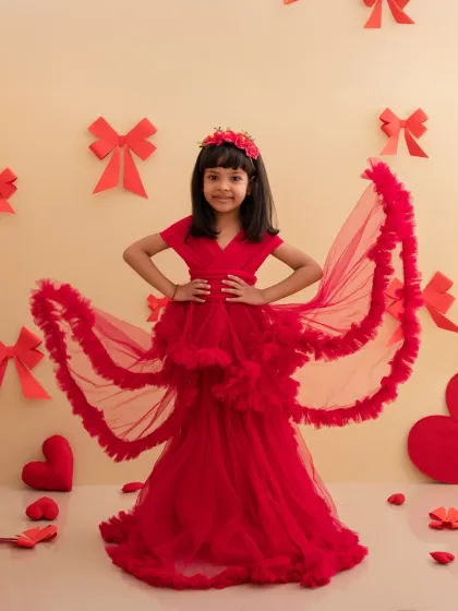 Showing off the beautiful layers of her red dress, this young lady is the perfect Valentine's princess.