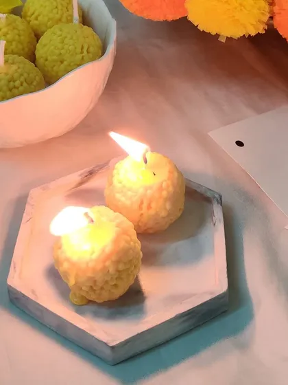 Adding a sweet, traditional touch to your festivities is easy with my motichoor ladoo candles. They look just like the real thing and fill the room with a beautiful, warm light.