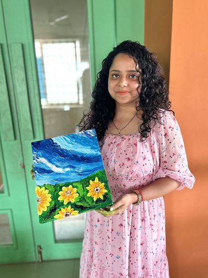 Another happy participant with her finished piece. Our workshops are designed to be beginner-friendly, ensuring everyone can create something they love.