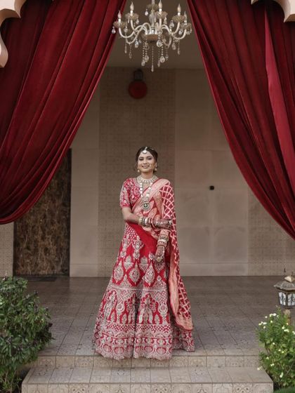 A timeless Gujarati bride. I styled her hair in a classic updo to go with her traditional gharchoda and red lehenga.