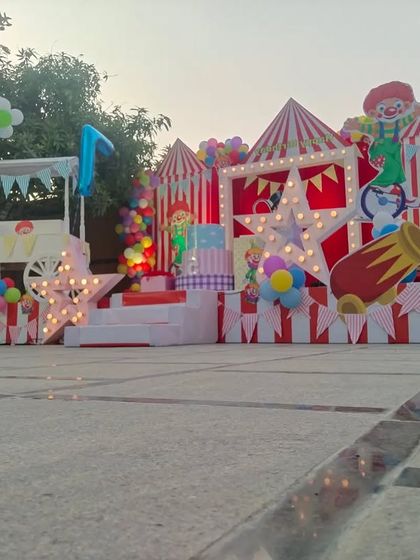 A ground-level view showcasing the impressive size and vibrant colors of the carnival party decorations.