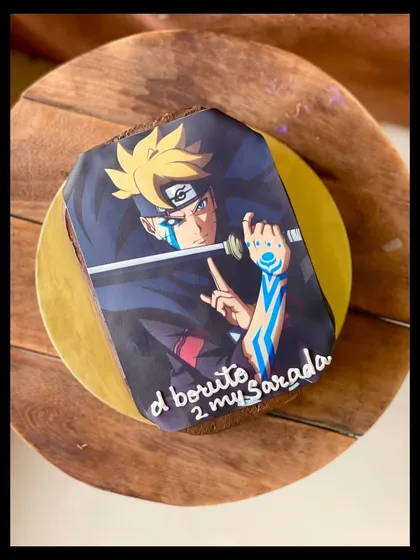A photo sheet cake in a rich Nutella flavor, featuring a custom image from the anime Boruto.