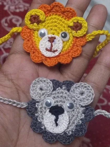 Roar-some lion and tiger face rakhis for the little ones. These animal-themed crochet rakhis are designed to be fun and comfortable for kids to wear all day.