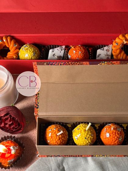 This Diwali, let our laddu-shaped candles add a touch of sweetness to your celebrations. This image shows our collection of mithai-shaped candles, perfect for unique festive decor.