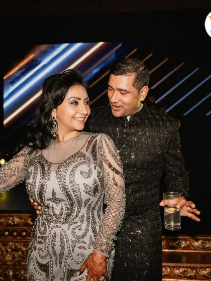 A candid moment of the couple enjoying a dance together during their Sangeet celebration.