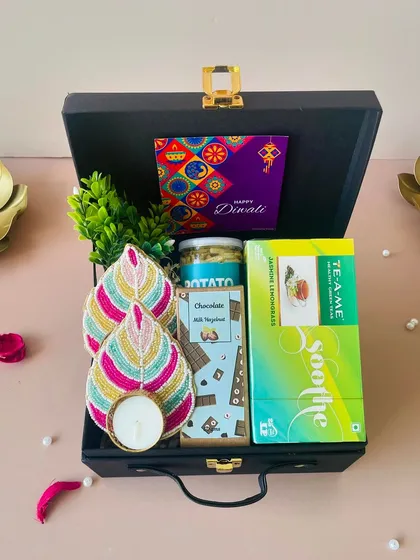 Another variation of the budget-friendly suitcase hamper, this time with potato flakes and a different chocolate bar. I can customize the contents based on your preferences.