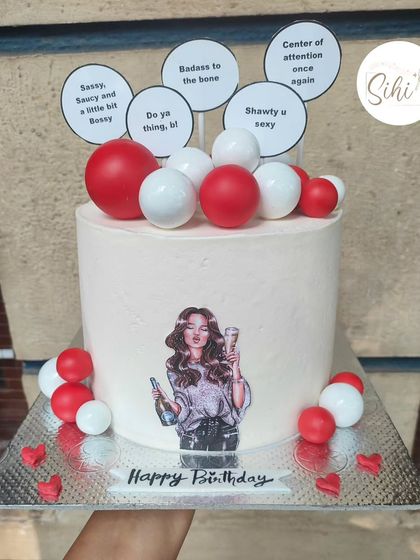 She's doing her thing. A sassy and fun birthday cake with a modern illustration, red and white baubles, and cheeky quote toppers.
