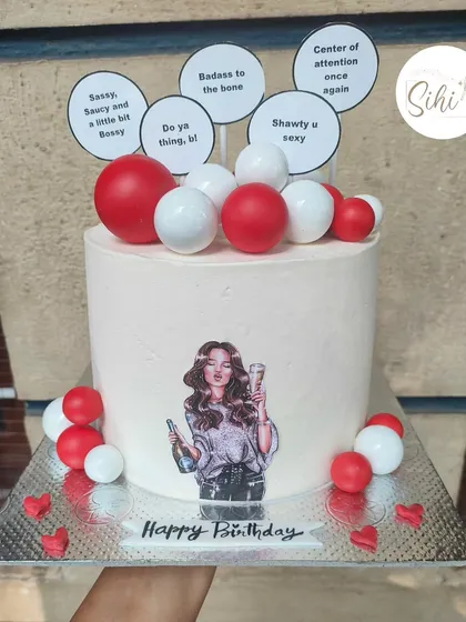 She's doing her thing. A sassy and fun birthday cake with a modern illustration, red and white baubles, and cheeky quote toppers.