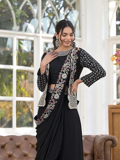 The combination of the classic black drape and the vibrant jacket makes this outfit a versatile choice. You can rent this exclusive designer piece from my studio.