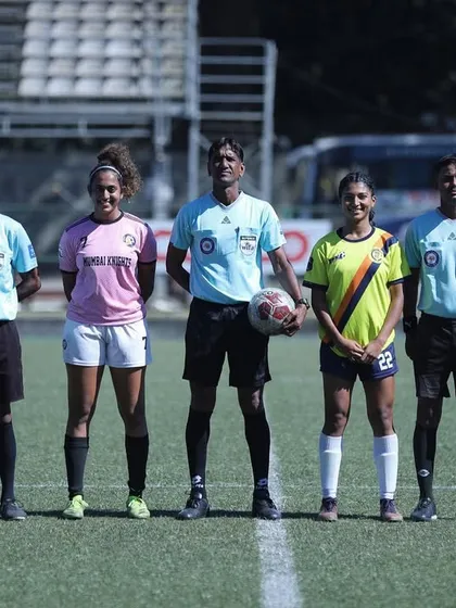 The captains and referees line up before the match, upholding the spirit of the game.