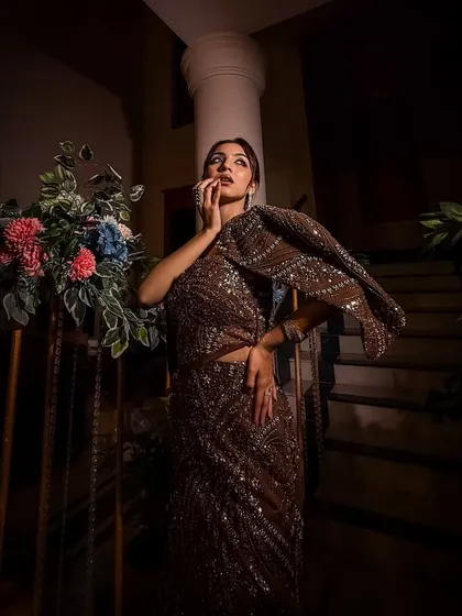 For the bride who loves to make a statement. This bold and modern cocktail look features a stunning brown embellished gown, proving that bridal glam can be fierce, confident, and totally unforgettable.