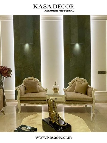 Another example of a space transformed by our Step Consultants. The dark, textured wall panels create a sense of drama and luxury, perfectly complementing the classic furniture.