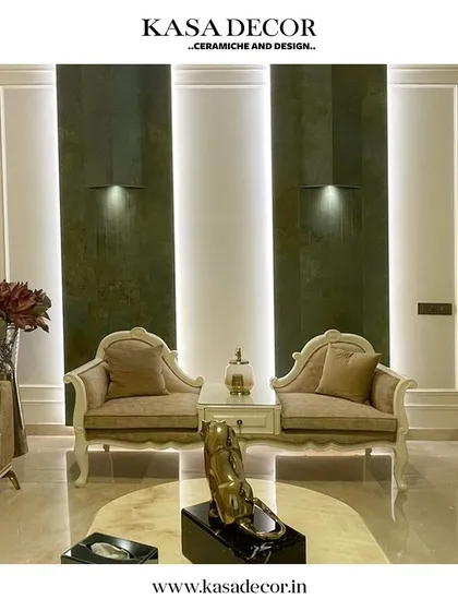 Another example of a space transformed by our Step Consultants. The dark, textured wall panels create a sense of drama and luxury, perfectly complementing the classic furniture.