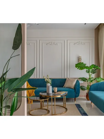 Another framed view of the living area, showcasing the uncluttered and elegant aesthetic. The clean lines of the furniture and the classic mouldings create a serene and sophisticated atmosphere.