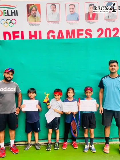 Our young tennis players and their coaches celebrating their wins at the DLTA Mini Tennis Open Tournament. This picture captures the supportive community we build at Rack4Pro.