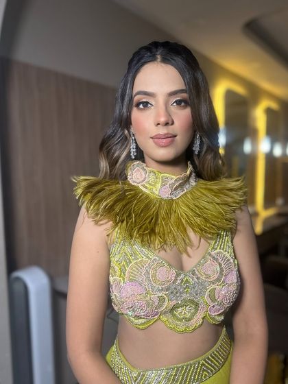 A beautiful soft glam makeup look for this client in a unique feathered top. This look was created by my artist Sunaina.