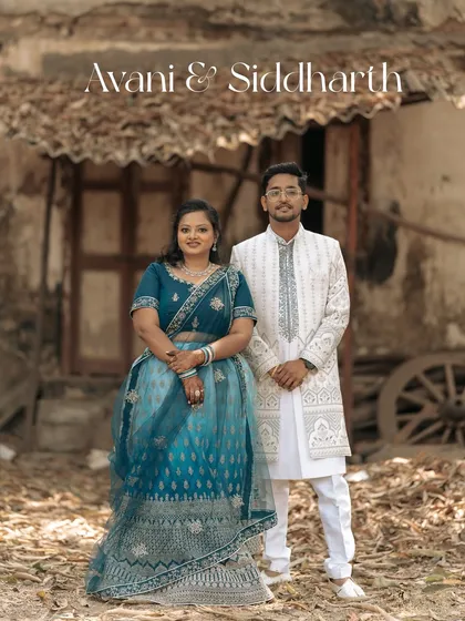 A classic, full-length portrait of the engaged couple. Their elegant traditional outfits and confident smiles make for a stunning photograph.