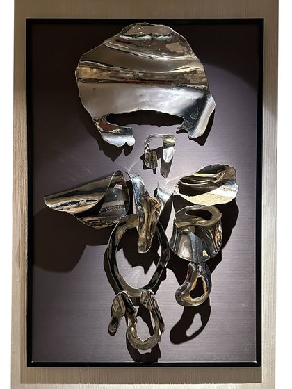 This abstract Ganpati is crafted from fragments of polished stainless steel, framed to create a modern spiritual icon. It symbolizes strength, resilience, and new beginnings.