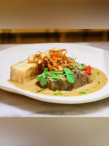 This seven-hour slow-cooked leg of lamb is a true labor of love. It melts in your mouth and is served with root vegetable dauphinois and a unique wasabi jus for a delightful kick.