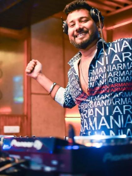 An energetic pose while mixing. I'm happy to be in your heart if you love me, and in your mind if you hate me.