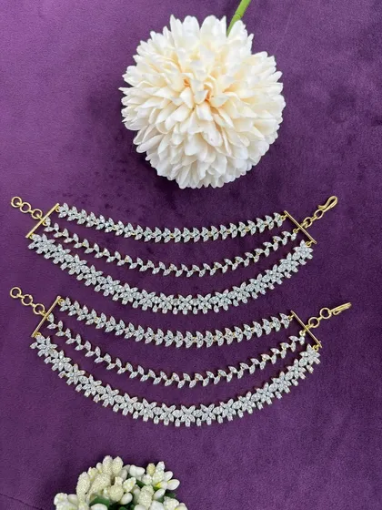 A pair of elegant, multi-layered AD zircon ear chains (sahara), designed to be attached to heavy earrings for support and added style.