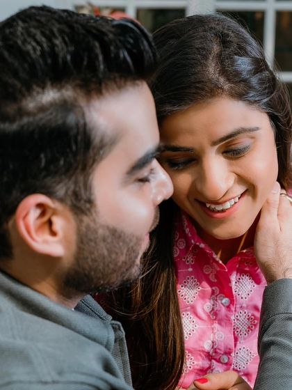 A close-up, intimate moment. The makeup is soft and romantic, letting the couple's connection be the focus.