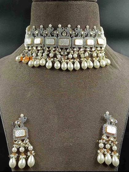 A modern choker set with white rectangular stones and pearl drops, ideal for a reception or cocktail party.