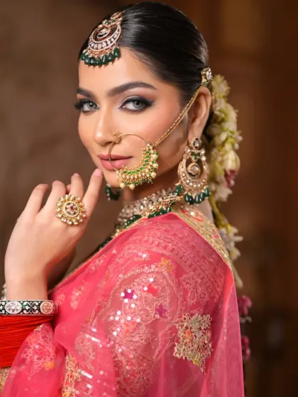 A stunning side profile that showcases the sharp winged liner and the beautiful contour of her cheekbones. The makeup is both elegant and powerful.