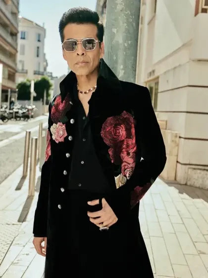 Inspired by celebrity style, this black indowestern long coat features bold, hand-embroidered floral motifs on the shoulders. I design these pieces to be conversation starters, ideal for cocktail events or high-profile parties.
