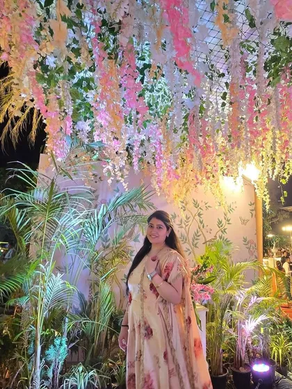 Posing under a stunning floral ceiling at a wedding reception. The decor and ambiance of an event inspire the style of dance I create for my clients.