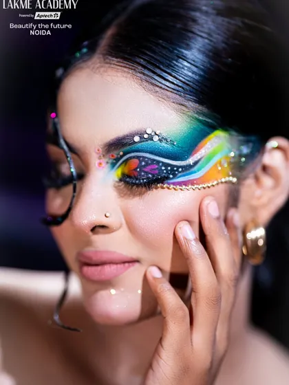 Eye makeup is an art form, and we teach you the latest trends. This close-up shows a vibrant Brazilian-style eye makeup look, featuring a multi-color blend and sharp graphic liner, a key technique for any aspiring makeup artist.