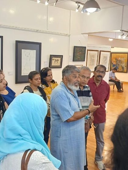 A group of students and organizers from the Indian Institute of World Culture listen intently during a guided tour of our exhibition. We are always happy to welcome groups to experience and learn about art.