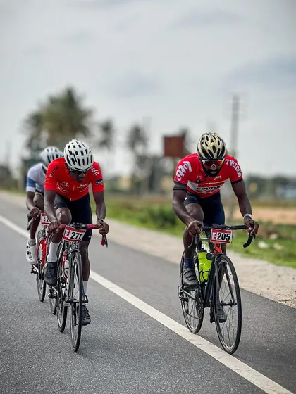 Two elite riders from the Cyclopedia academy, showing their team colors.