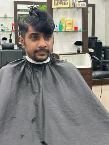 Getting the sections right is the first step to a perfect haircut. Here, I'm preparing the hair for a precision cut.