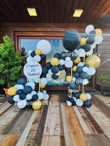 A wider view of the stylish 28th birthday decor, showing how it can be used to frame an entrance.