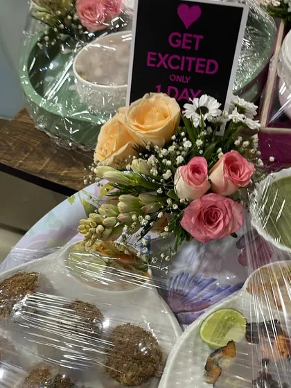 I also create beautifully packaged food gifts for special occasions. This platter includes a custom menu, fresh flowers, and elegant serveware.