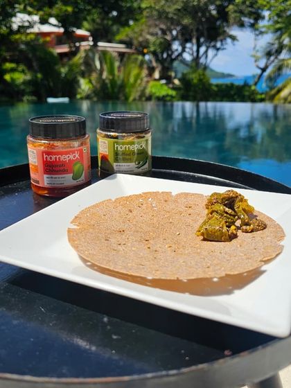 A simple khakhra by the pool gets an instant upgrade with a spoonful of our Stuffed Green Chilli pickle. It's the easiest way to make any snack more exciting.
