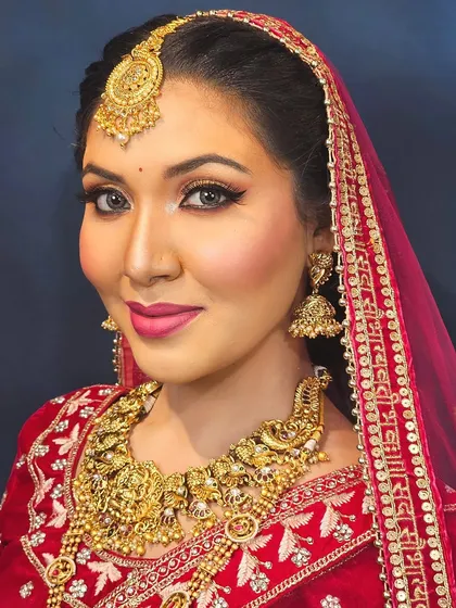 A close-up shot focusing on the eye makeup and the traditional bindi, essential elements of a South Indian bridal look.