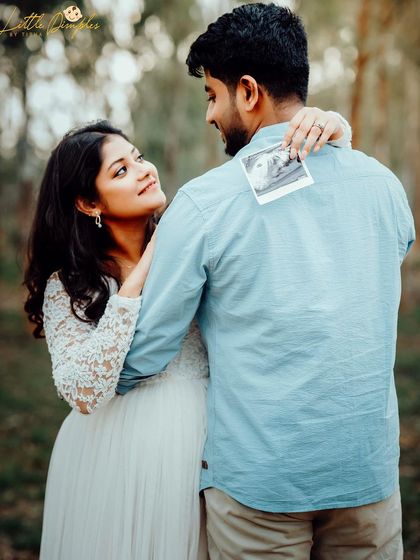 A creative announcement photo where the mom-to-be holds up their first sonogram picture. It's a wonderful way to include the baby in the maternity session.