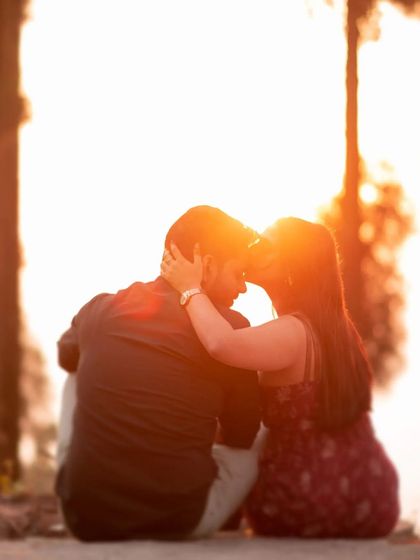 Capturing the warmth of the golden hour. Here, the sun flares perfectly as Arihant and Ishu share a quiet, intimate moment. This kind of natural light is what makes outdoor pre-wedding photography so magical.
