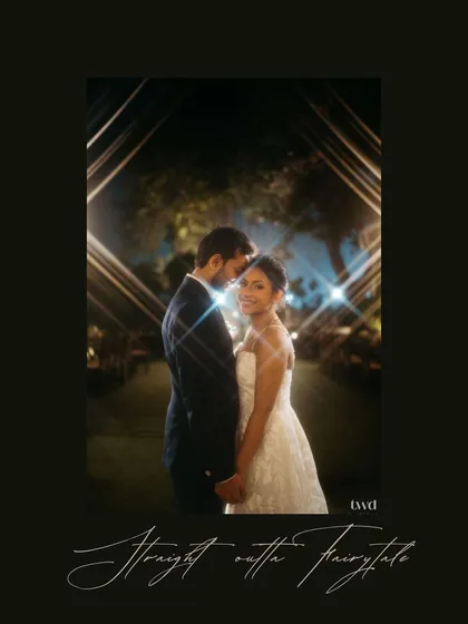 A stunning night portrait of the bride and groom, framed by glowing lights that create a diamond shape around them. This shot, captioned "Straight outta a Fairytale," perfectly captures the magical and cinematic feel of their wedding day.