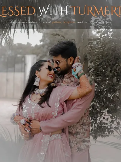 An artistic portrait of the couple during their Haldi ceremony. The soft, hazy filter and the loving embrace create a dreamy and romantic image, perfectly captioned "Blessed with Turmeric."